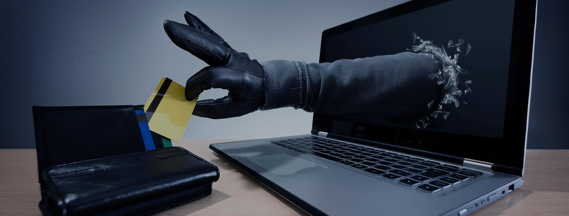 gloved-hand-coming-out-of-computer-to-steal-credit-card-information