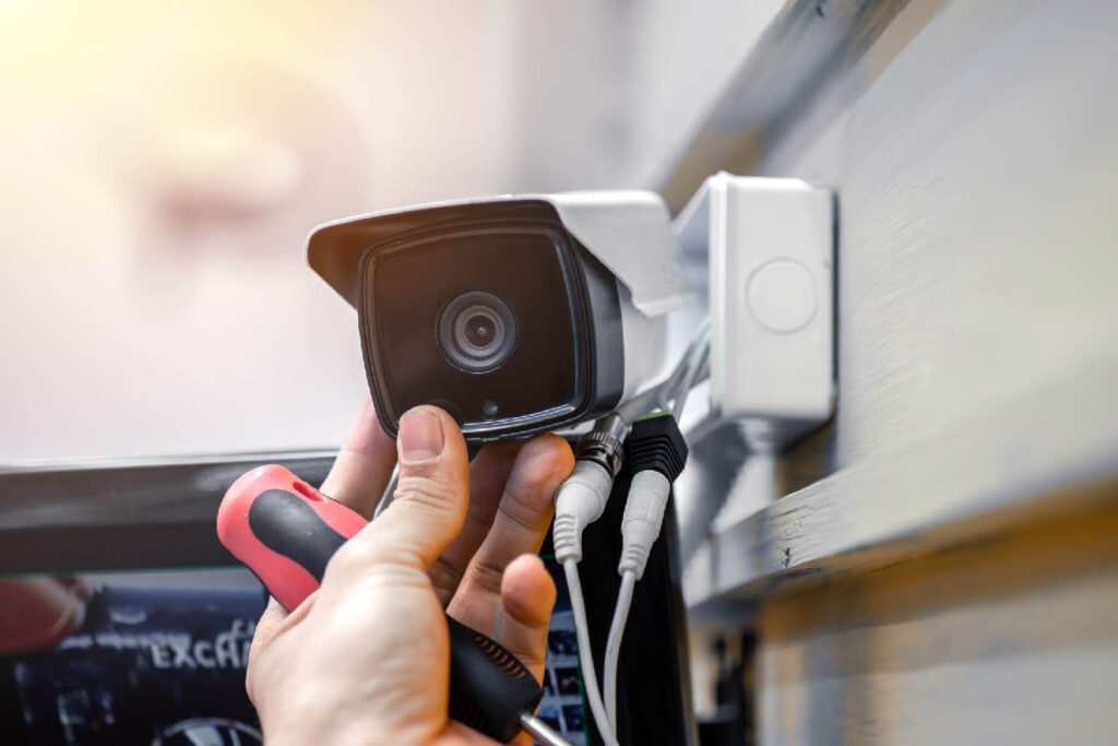 Technician adjusting a security camera